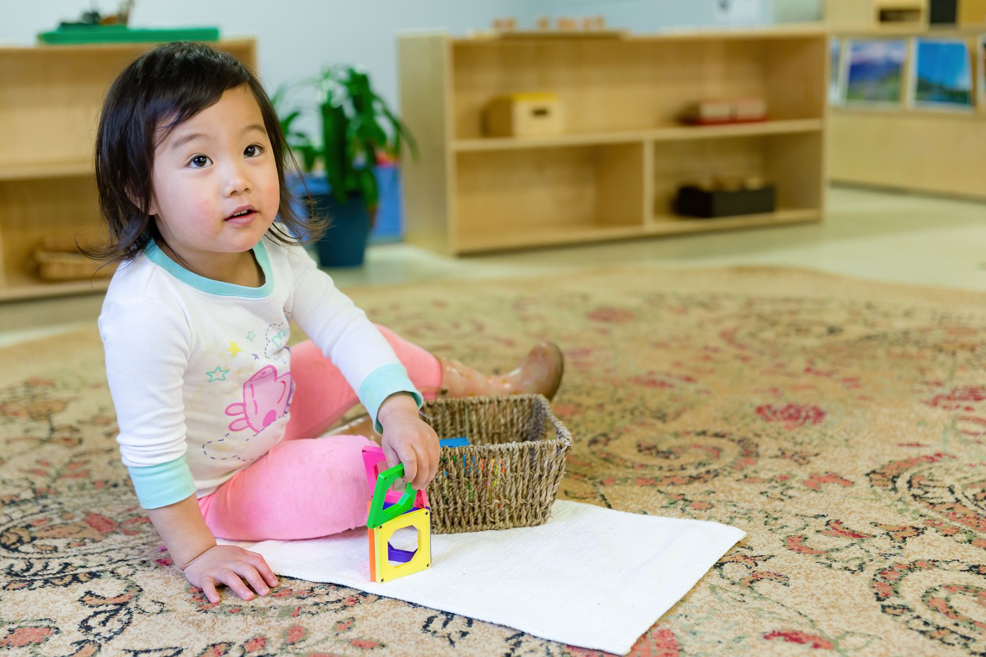 Montessori toddler working with materials