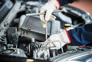 Mechanic at Work on a Car Engine - Auto Repairs in Columbus, OH