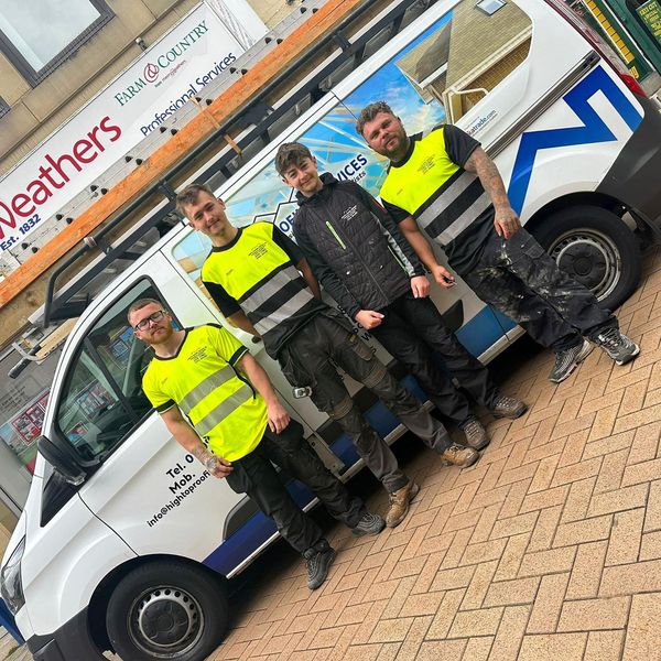 A picture of Hightop Roofers in Birmingham stood in front of the van