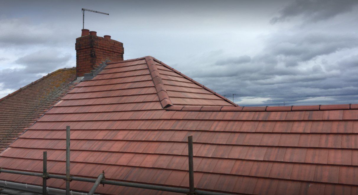 A picture of a ridge and hip tile repairs carried out by roofers Birmingham