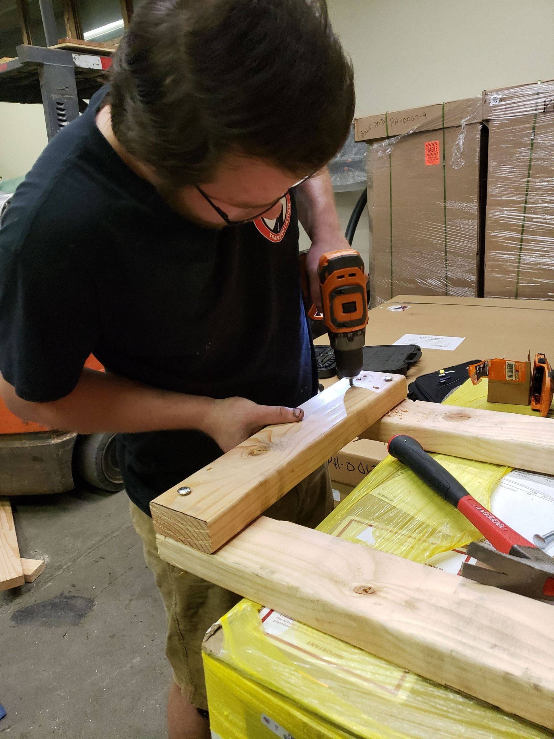 Drilling a Piece of Wood Board — Stroudsburg, PA — New Horizons Transportation LLC