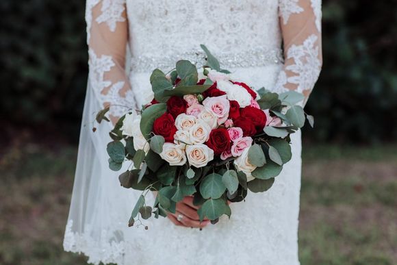 A Bride Holding a Bouquet of Roses — Mission, TX — Soiree
