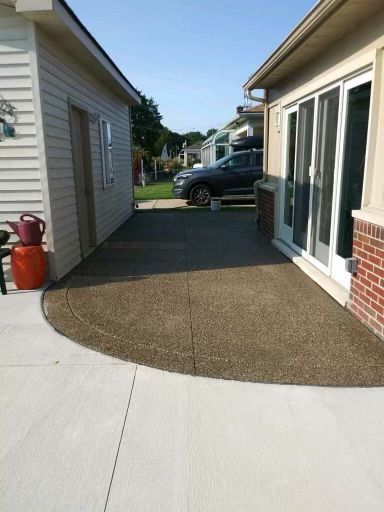 A car is parked in the driveway of a house