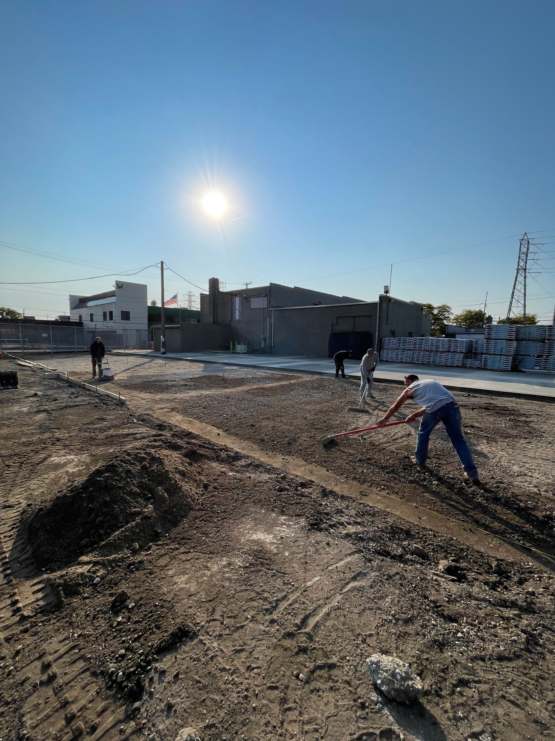 A group of people are working on a construction site.