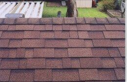 Brown asphalt shingle roof.