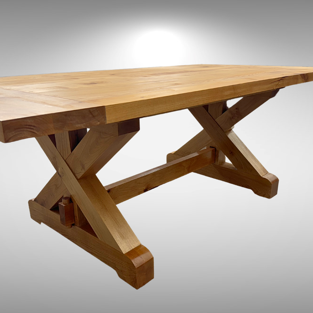 A wooden table with crossed legs and a gray background