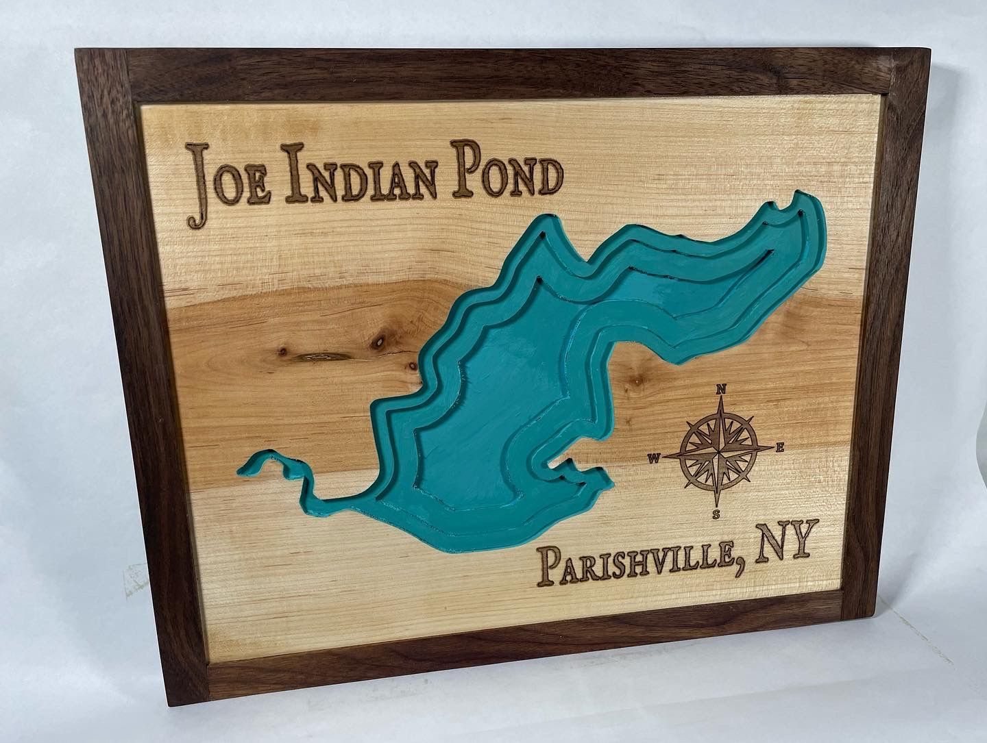 A wooden sign that says joe indian pond on it