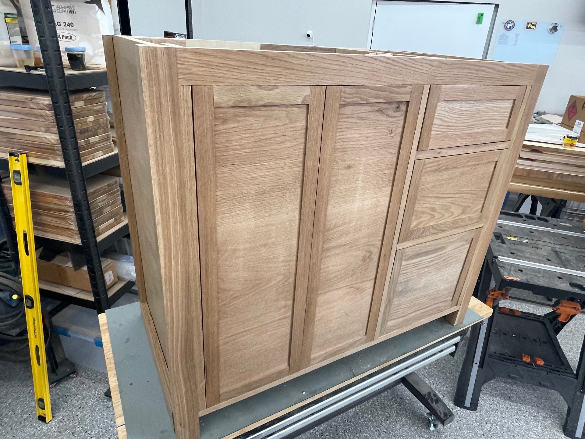 A wooden cabinet is sitting on top of a wooden table.