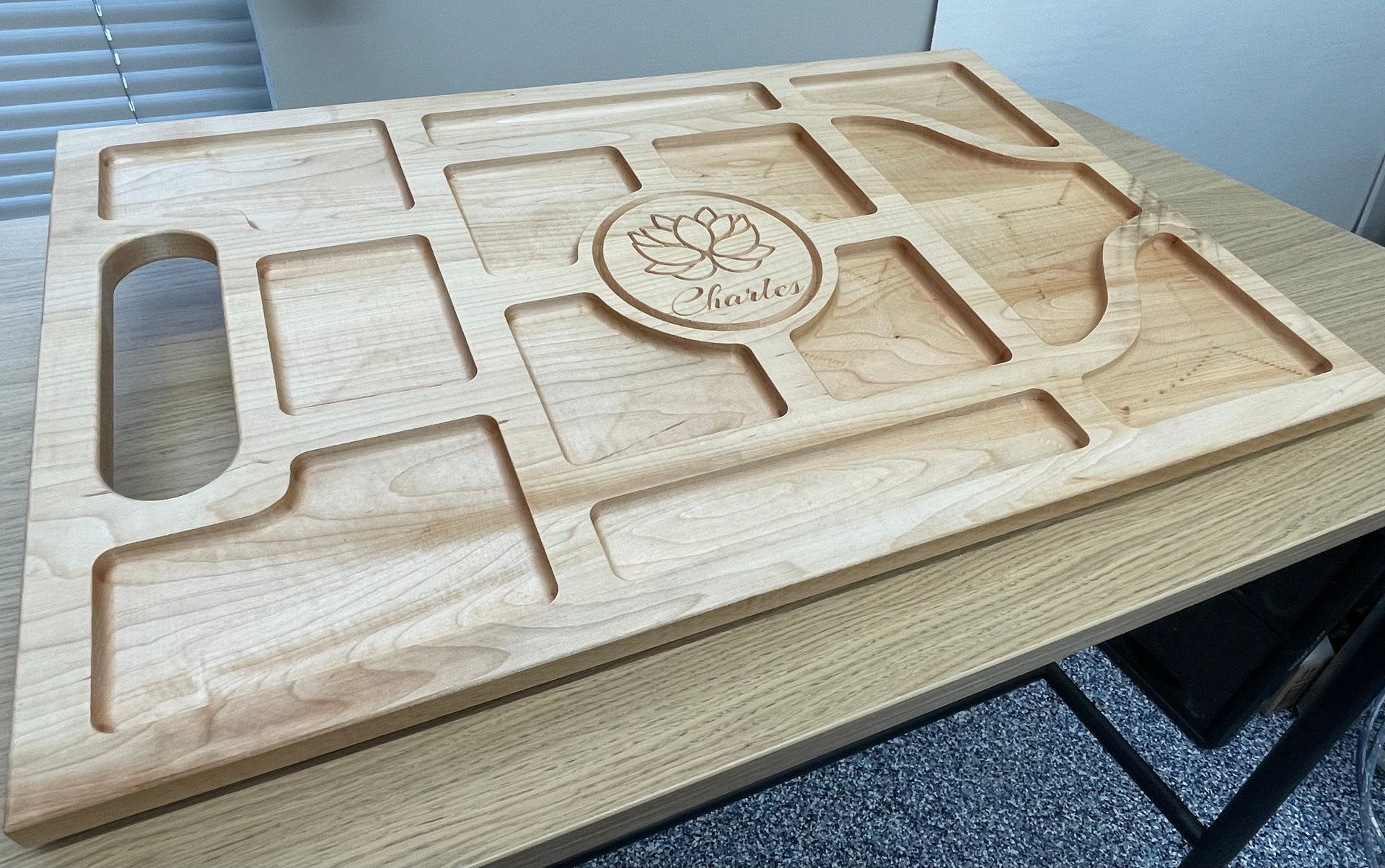 A wooden tray is sitting on a wooden table.
