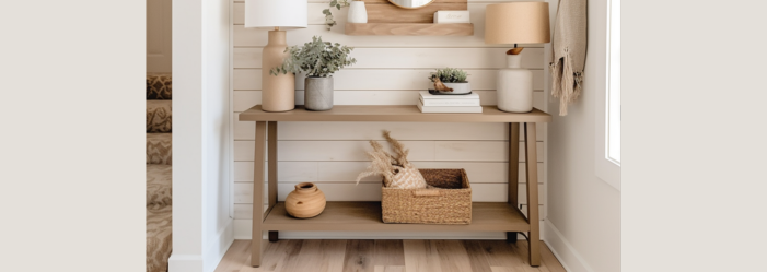 A hallway with a wooden table and a wicker basket on it.