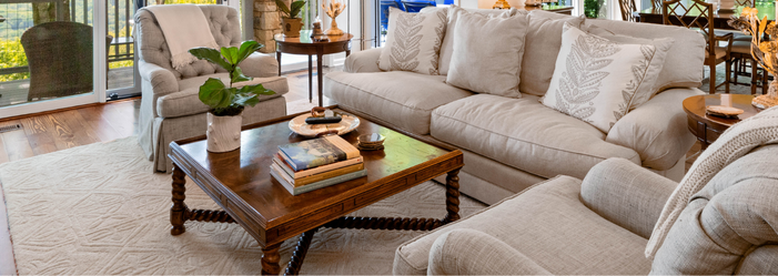 A living room filled with furniture and a coffee table.