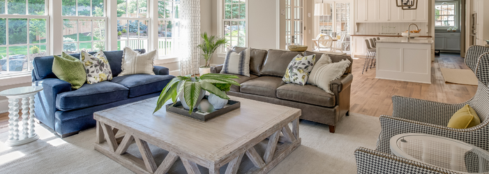 A living room filled with furniture and a coffee table.