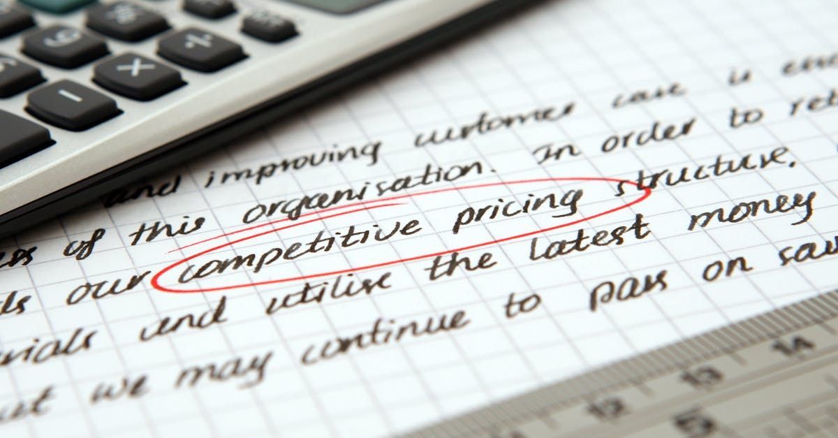 A calculator is sitting on top of a piece of paper that says competitive pricing