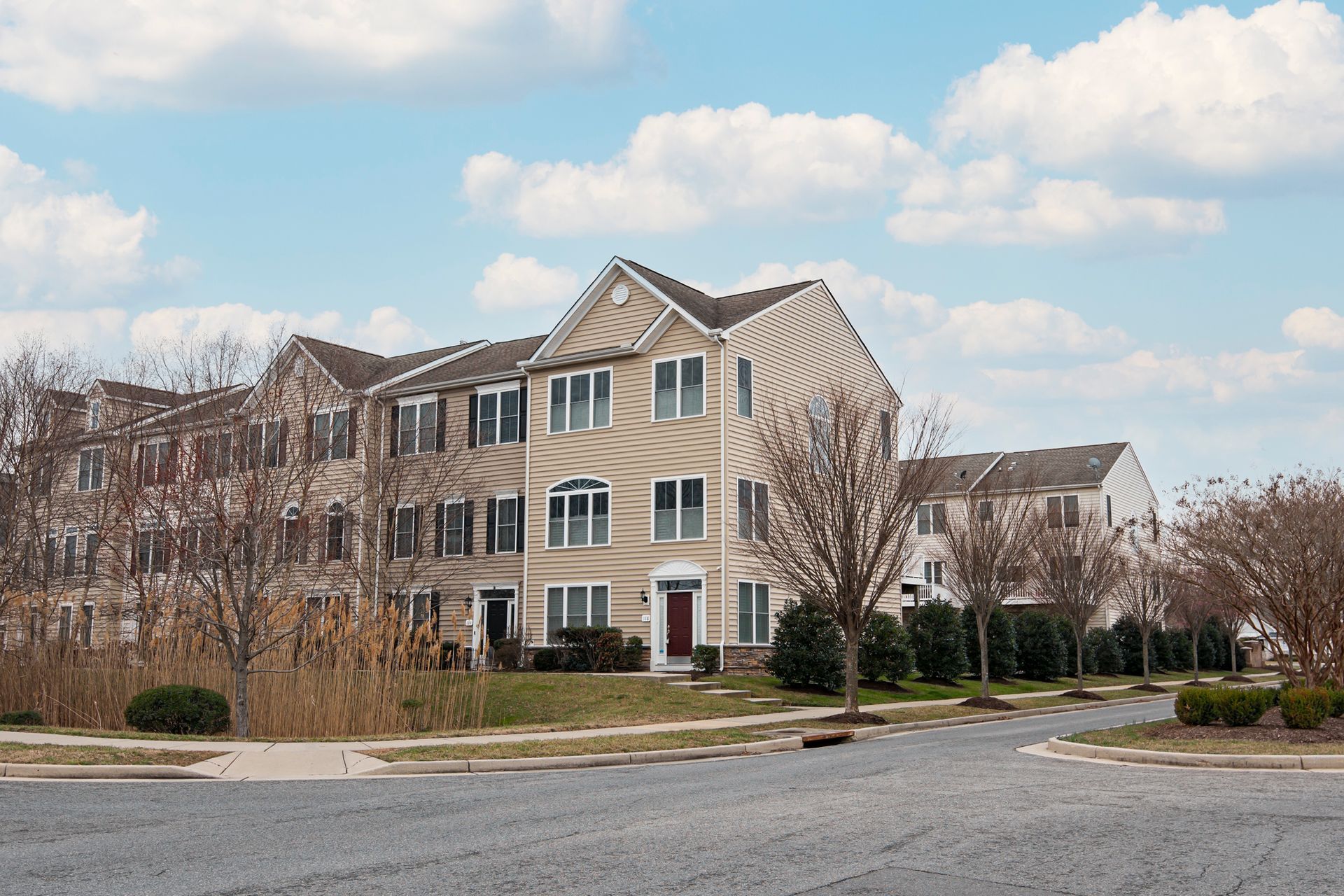 A vase of flowers is sitting on a table next to a window.