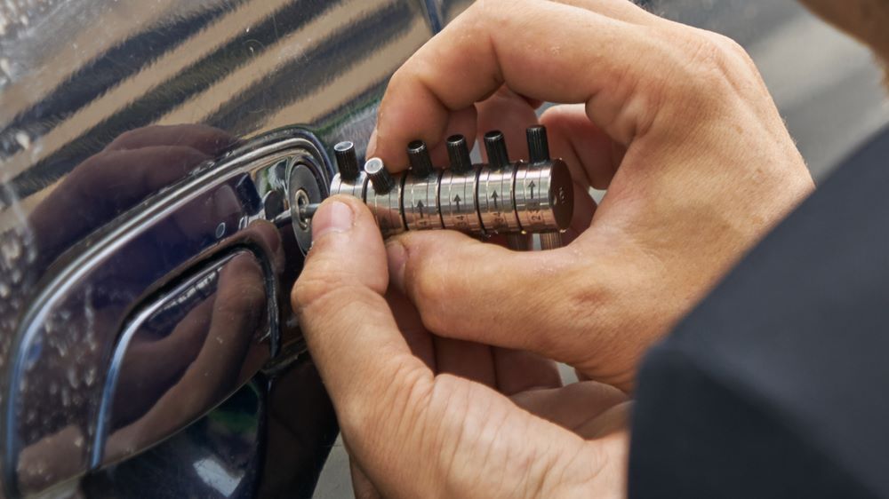 A Close Up of a Person Holding a Key in Their Hand — Coffs City Lockmart Pty Ltd in Bellingen, NSW