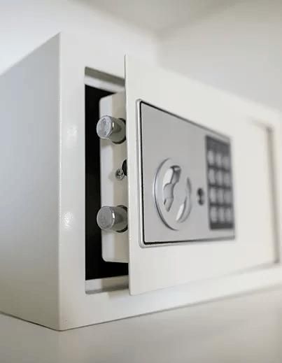 A White Safe with The Door Open Is Sitting on A Table — Coffs City Lockmart Pty Ltd in North Boambee Valley, NSW