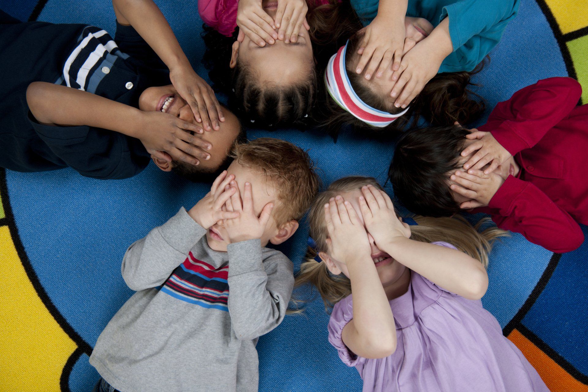 Kids covering their eyes — Bronx, NY — A Continuation of a Dream Daycare Center