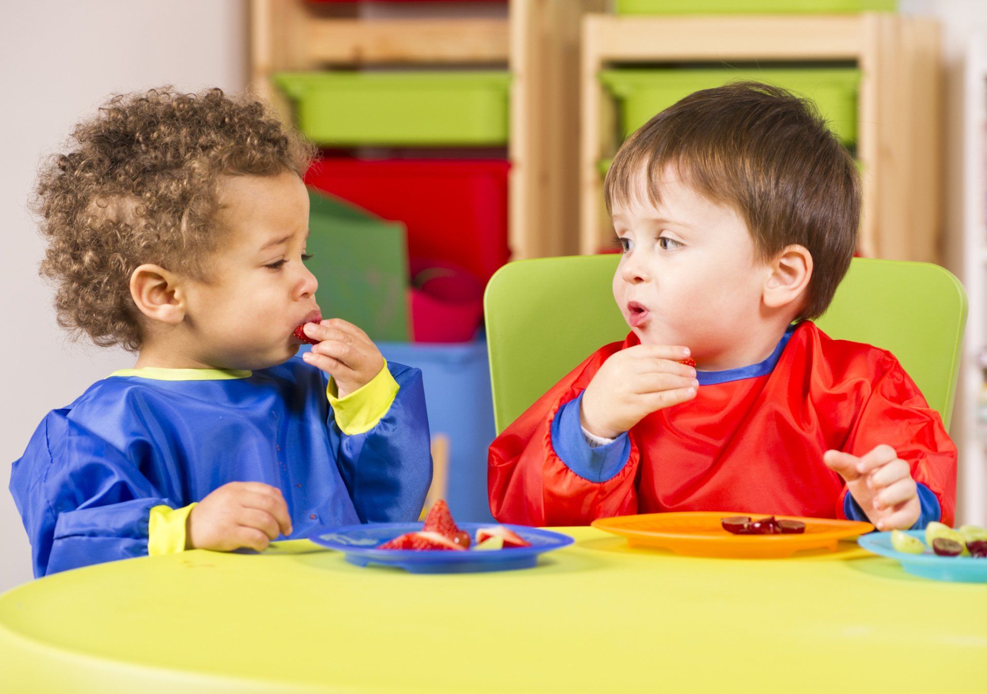 Two kids eating fruits — Bronx, NY — A Continuation of a Dream Daycare Center