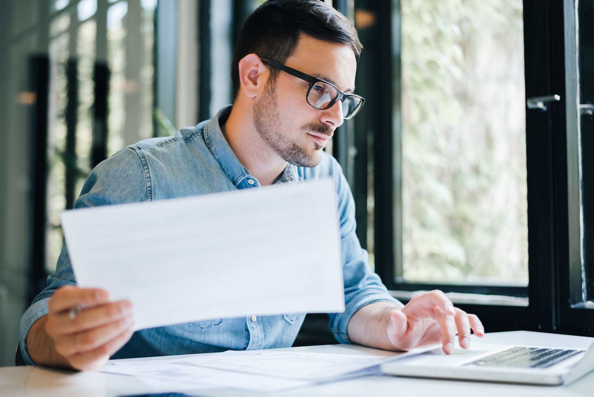 A man is reviewing some documents.