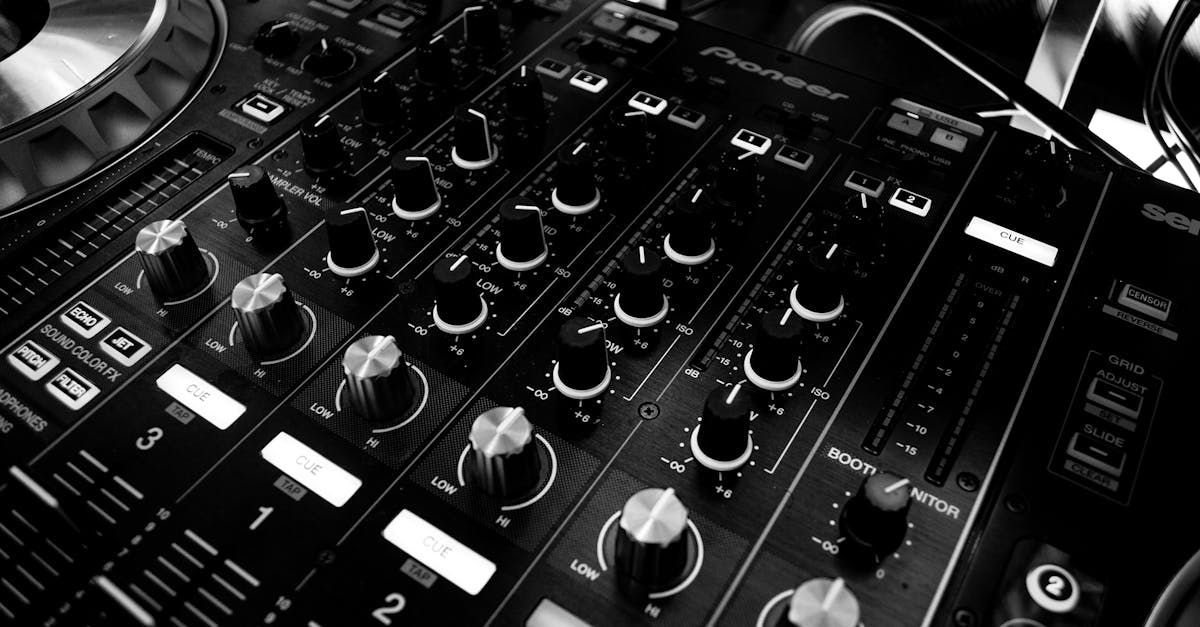 A black and white photo of a dj 's mixer.