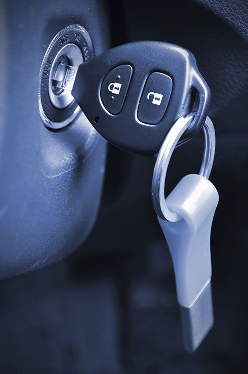 A close up of a car key in the ignition