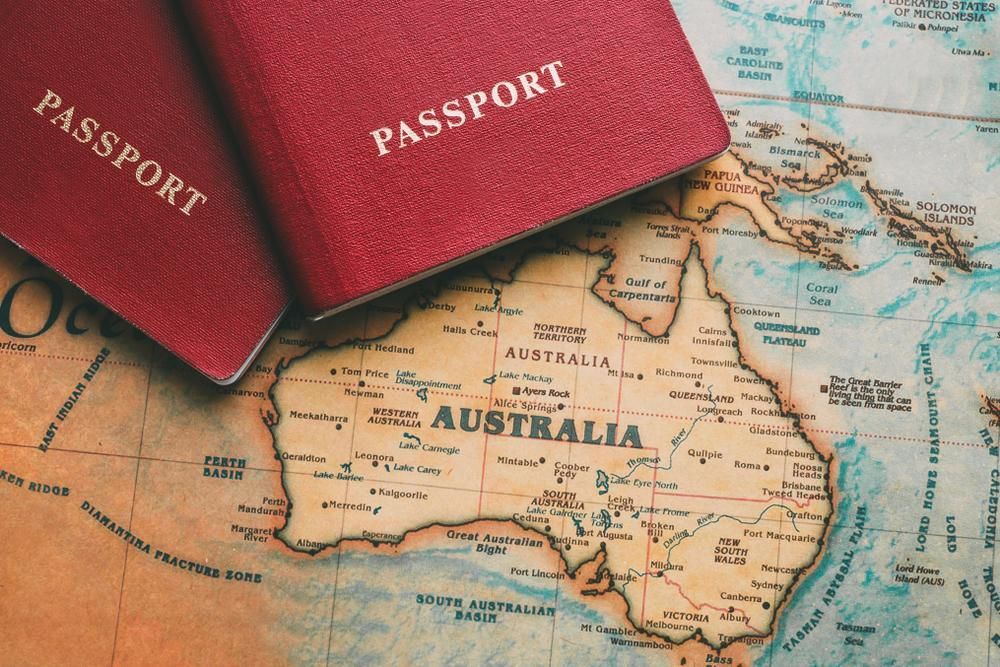 Two Passports Are Laying on Top of a Map of Australia — Mullumbimby Comprehensive Health Centre in Mullumbimby, NSW
