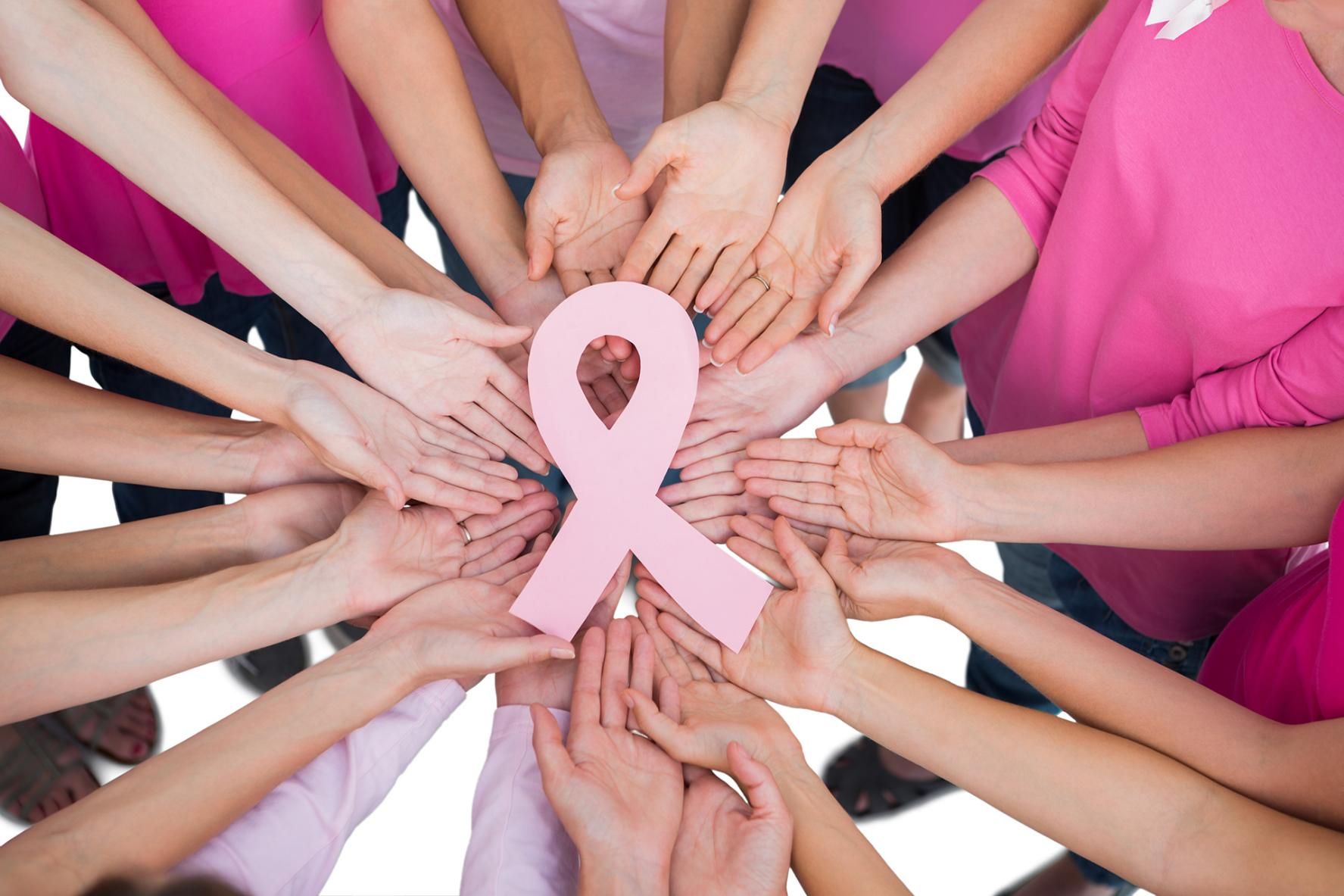 Group of People Are Holding a Pink Ribbon in Their Hands — Mullumbimby Comprehensive Health Centre in Mullumbimby, NSW