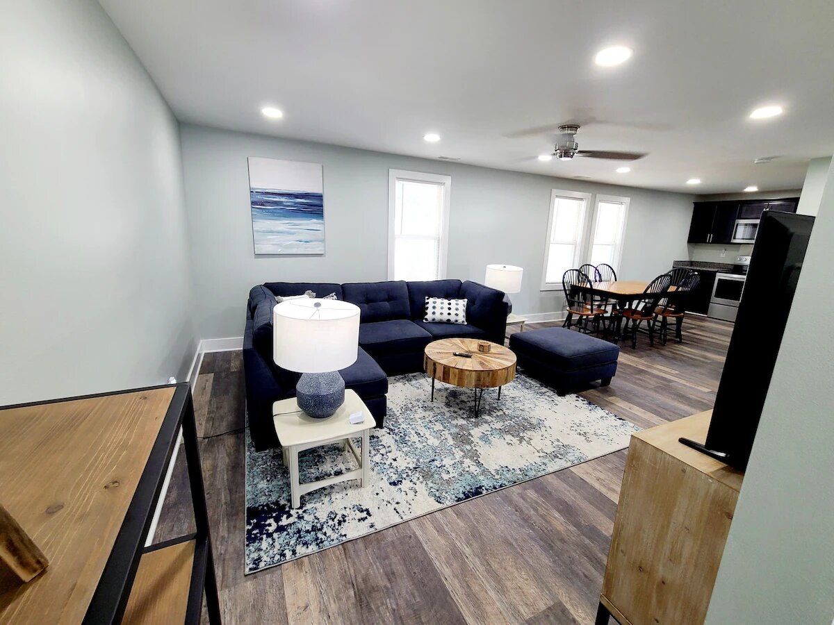 A living room with a couch and a flat screen tv
