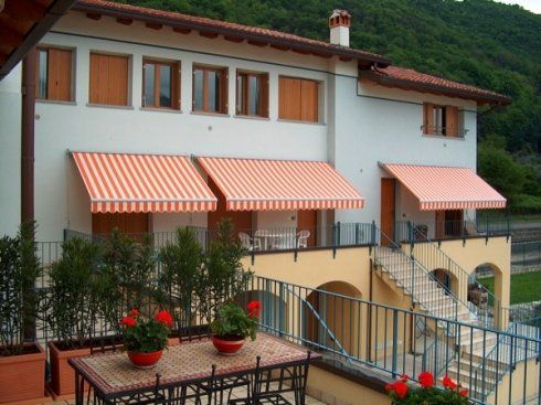 Residence con tende da sole estendibili