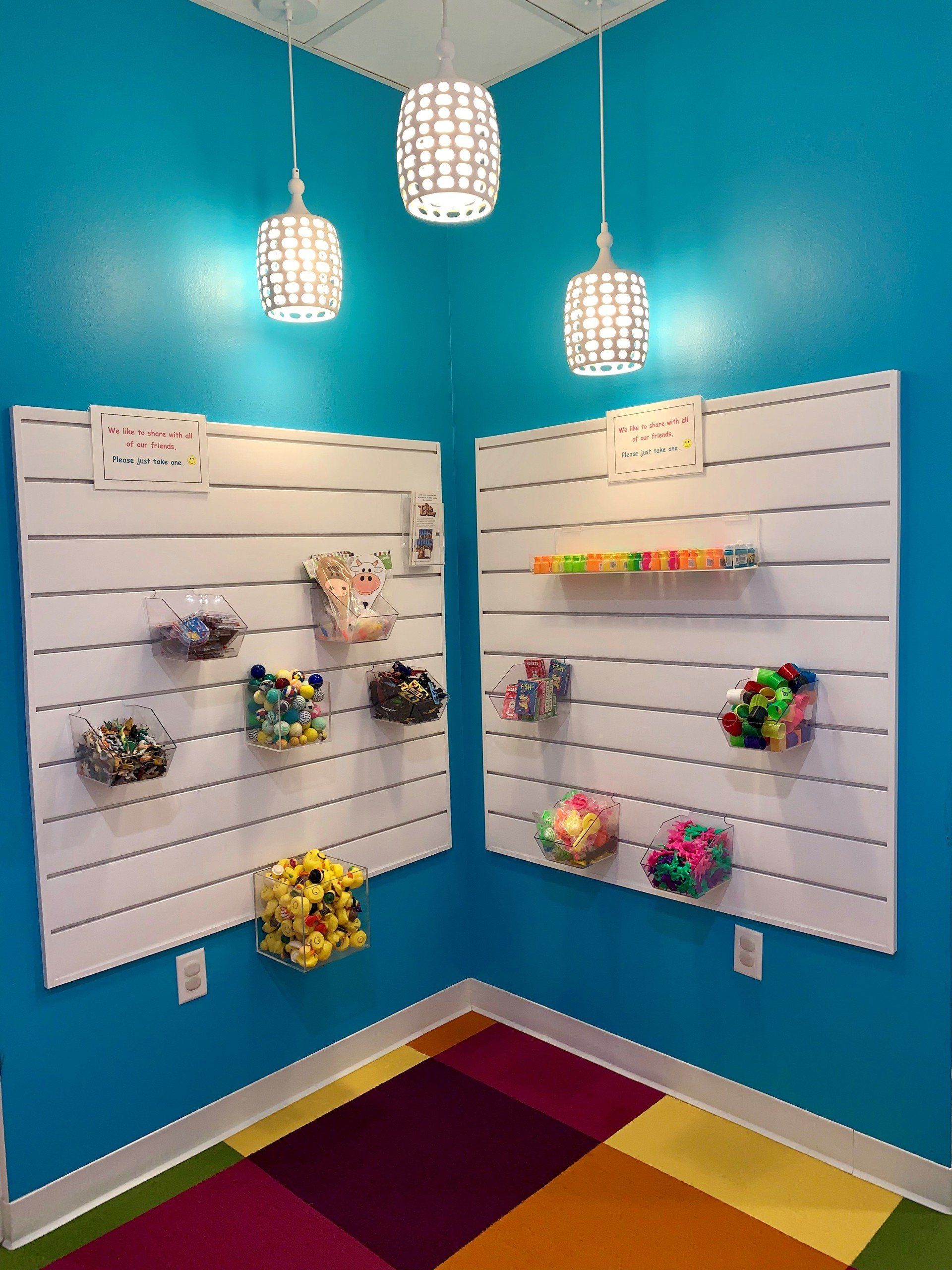 A room with blue walls and a colorful rug