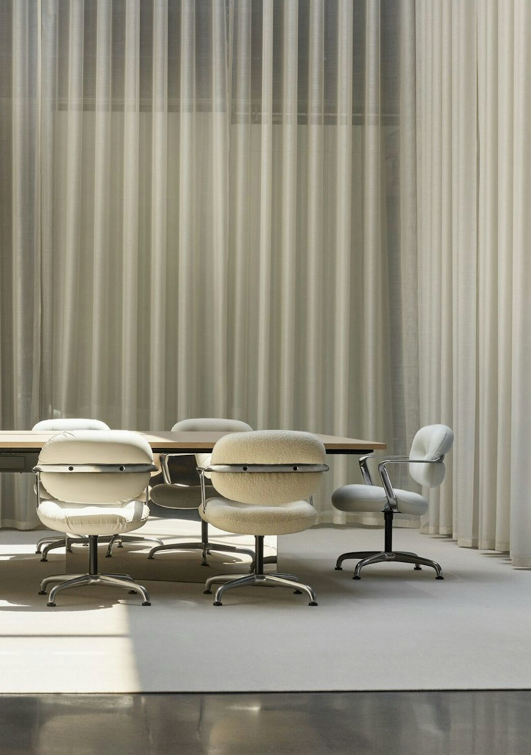 Close-up of a mustard-yellow upholstered sofa cushion and armrest