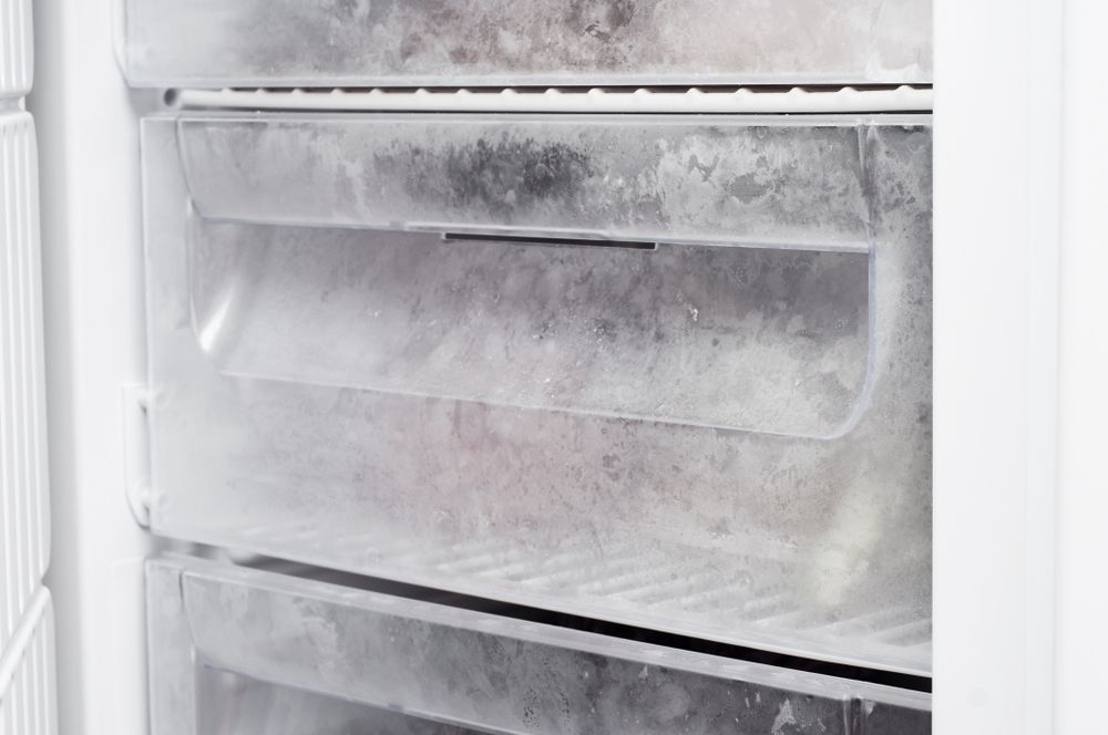 Open Freezer Interior With Heavy Frost Buildup — Les Carman Cooling Solutions in El Arish, QLD