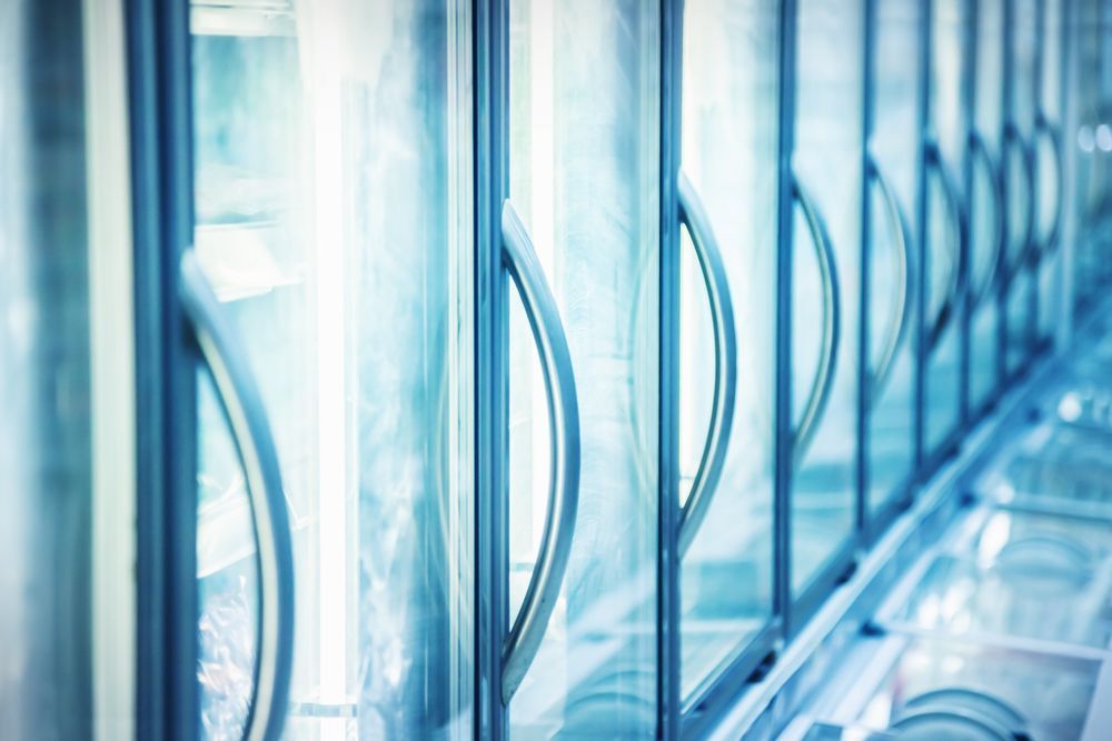 Row of Glass Freezer Doors With Silver Handles — Les Carman Cooling Solutions in El Arish, QLD