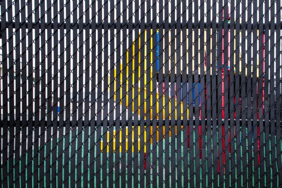 A Black Chain Link Fence with A Playground in The Background - Sequim, WA- NW Chainlink Fence Co