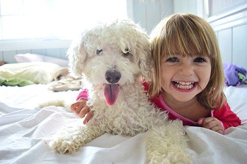Raccoon Valley Animal Hospital — Children Along with their Pet in Mullica Hill, NJ