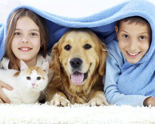 Raccoon Valley Animal Hospital — Children Along with their Pet in Mullica Hill, NJ