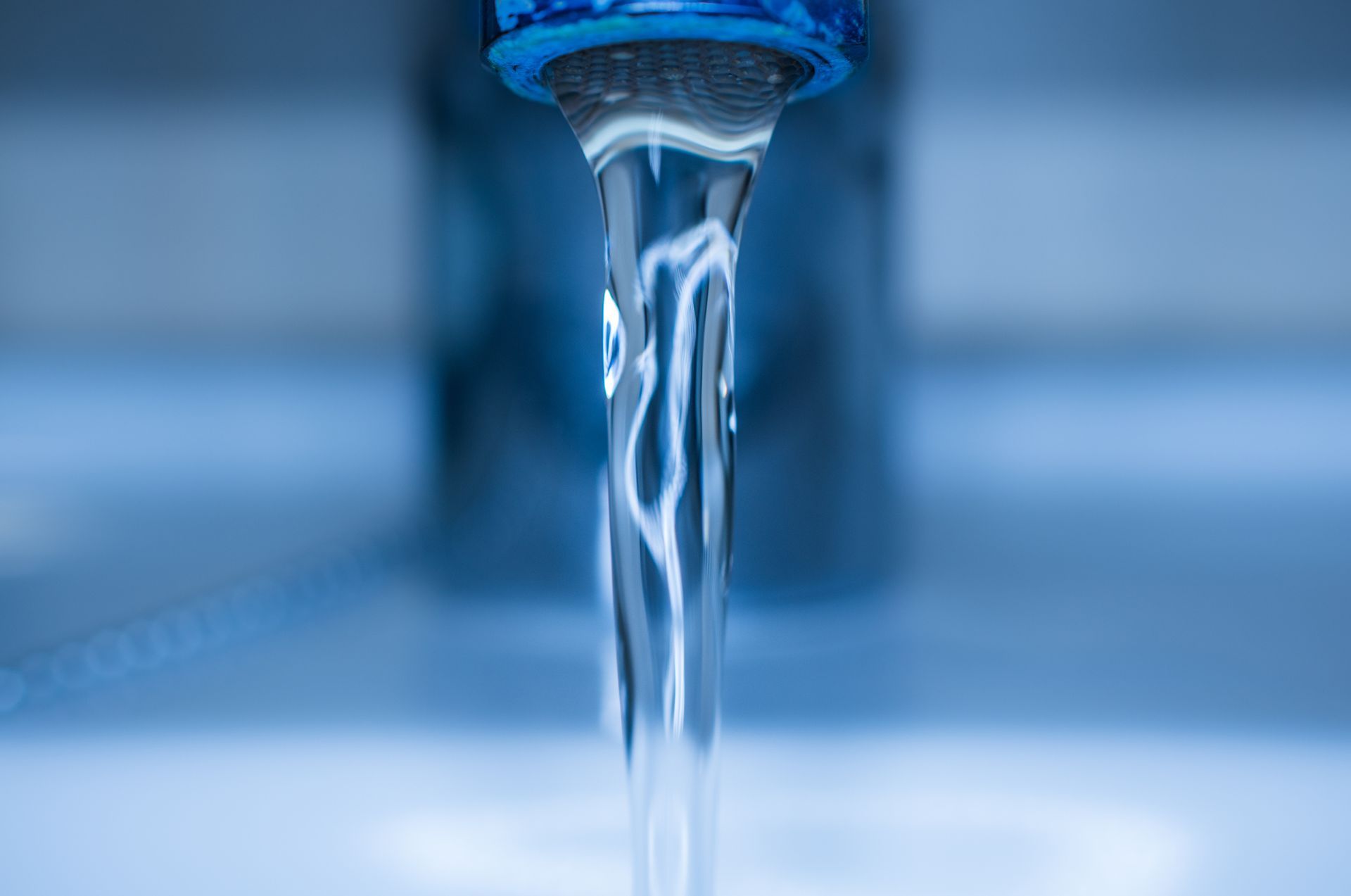 Water coming out of a tap.