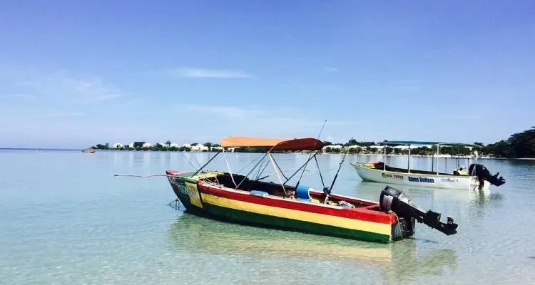 A couple of boats are floating on top of a body of water.