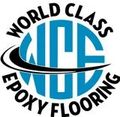 Logo for World Class Epoxy Flooring, featuring blue circle, black swoosh, and text.