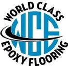 Logo for World Class Epoxy Flooring, featuring blue circle, black swoosh, and text.