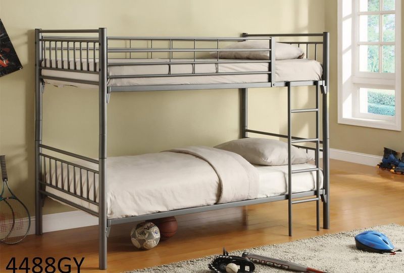 A bedroom with a bunk bed and a soccer ball on the floor