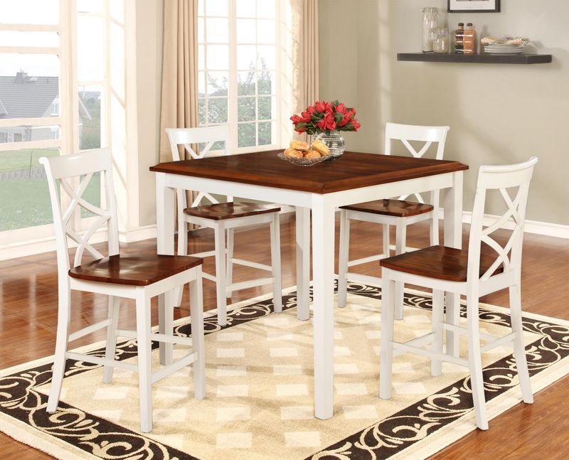 A dining room with a table and chairs and a rug.