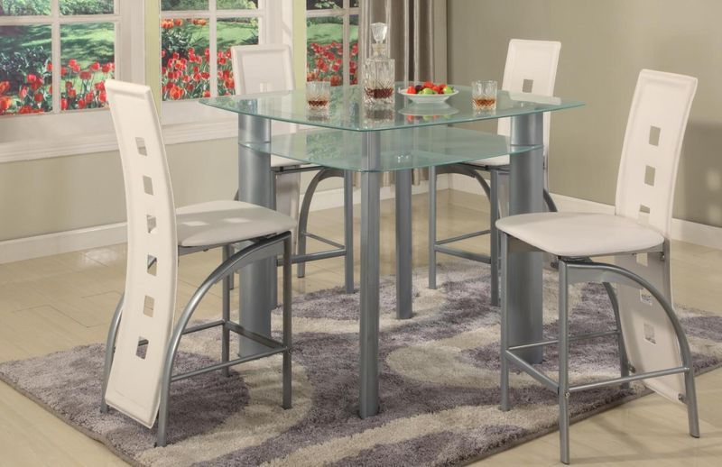 A dining room with a glass table and white chairs