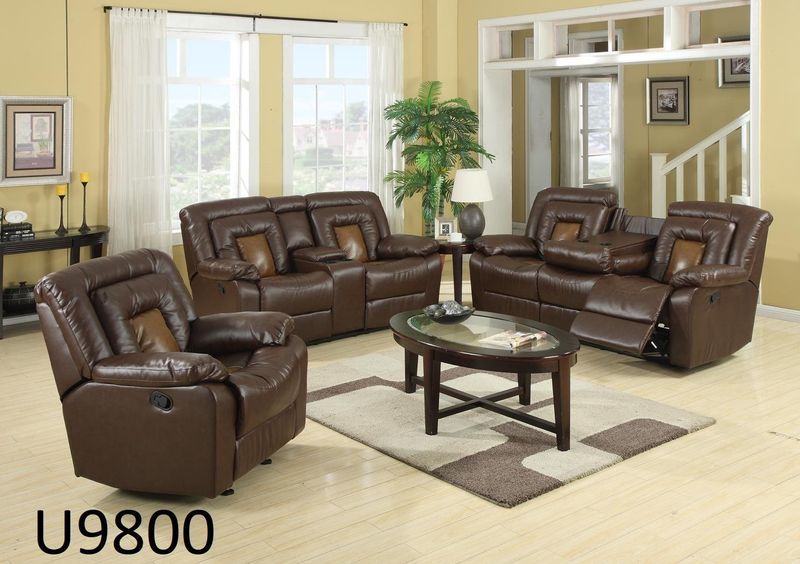 A living room with a couch a chair and a coffee table