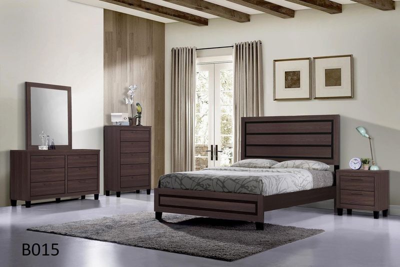 A bedroom with a bed dresser mirror and nightstand