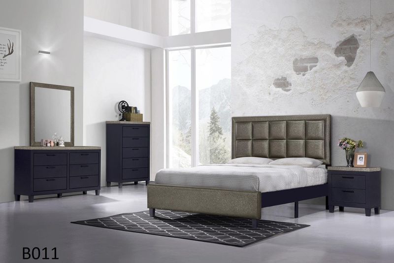 A bedroom with a bed dresser mirror and nightstand