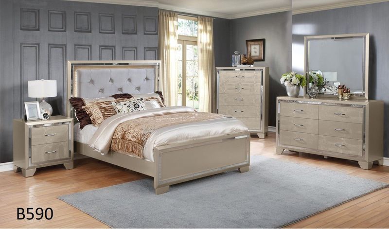 A bedroom with a bed , dresser , nightstand , mirror and rug.