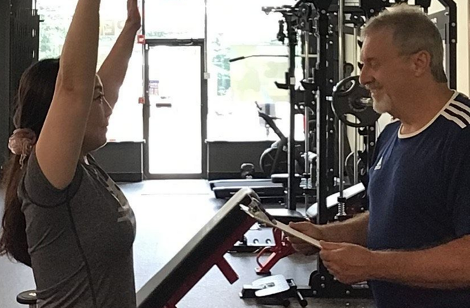 Personal trainer and client doing a movement assessment