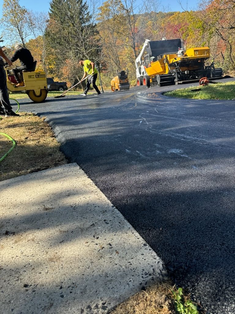 A group of people are working on a road.