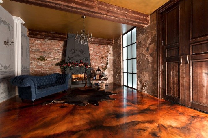 A living room with a couch and a fireplace.